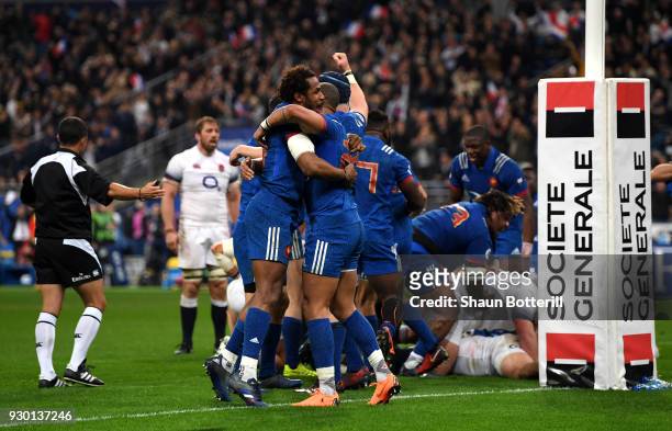 The French team celebrate victory after the NatWest Six Nations match between France and England at Stade de France on March 10, 2018 in Paris,...