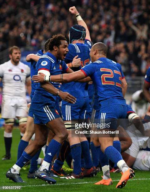 Benjamin Fall of France celebrates with teammate Gael Fickou after their victory of the NatWest Six Nations match between France and England at Stade...