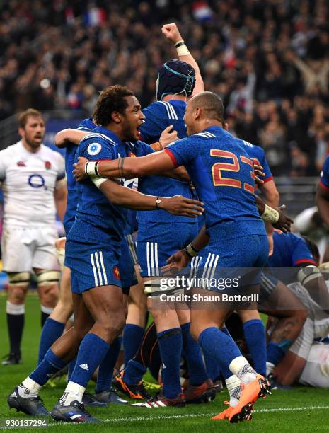 Benjamin Fall of France celebrates with teammate Gael Fickou after their victory of the NatWest Six Nations match between France and England at Stade...