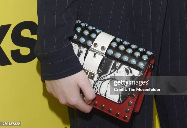 Elle Fanning, bag detail attends the premiere of Galveston at the Paramount Theatre on March 10, 2018 in Austin, Texas.