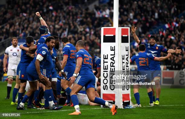 The French team celebrate their victory after the NatWest Six Nations match between France and England at Stade de France on March 10, 2018 in Paris,...