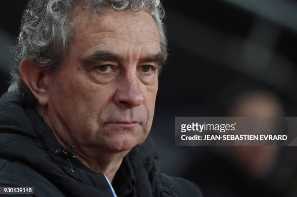 Saint-Etienne's former player and sport co-ordinator Dominique Rocheteau looks on ahead of the French L1 football match between Rennes and...
