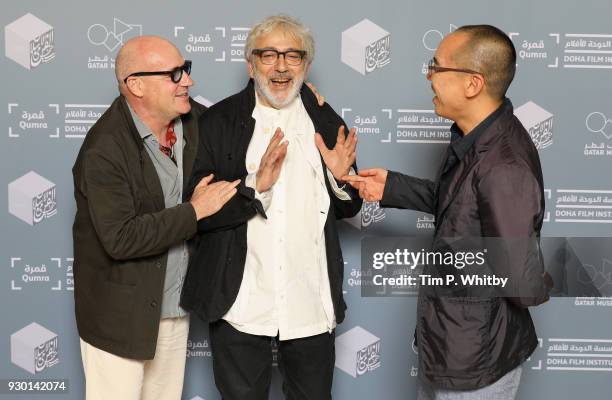 Director Gianfranco Rosi, Doha Film Institute Artistic Advisor Elia Suleiman and director Apichatpong Weerasethakul attends the "Footprints"...