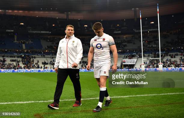 Dylan Hartley and Owen Farrell of England look dejected after the NatWest Six Nations match between France and England at Stade de France on March...