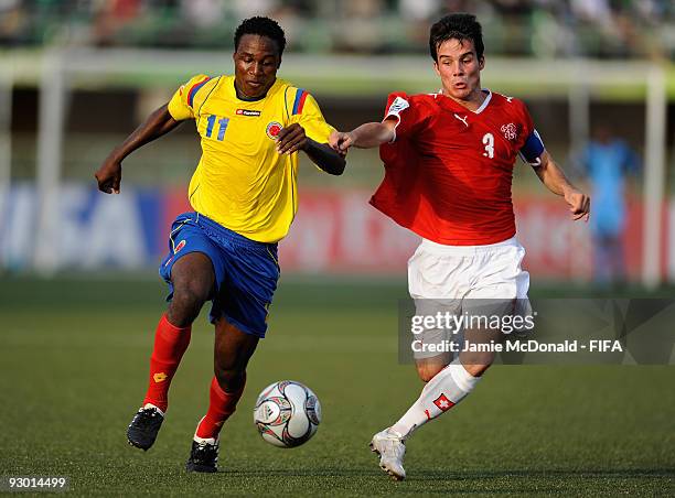 Janick Kamber of Switzerland battles with Wilson Cuero of Colombia during the FIFA U17 World Cup Semi-Final 1 between Colombia and Switzerland at the...