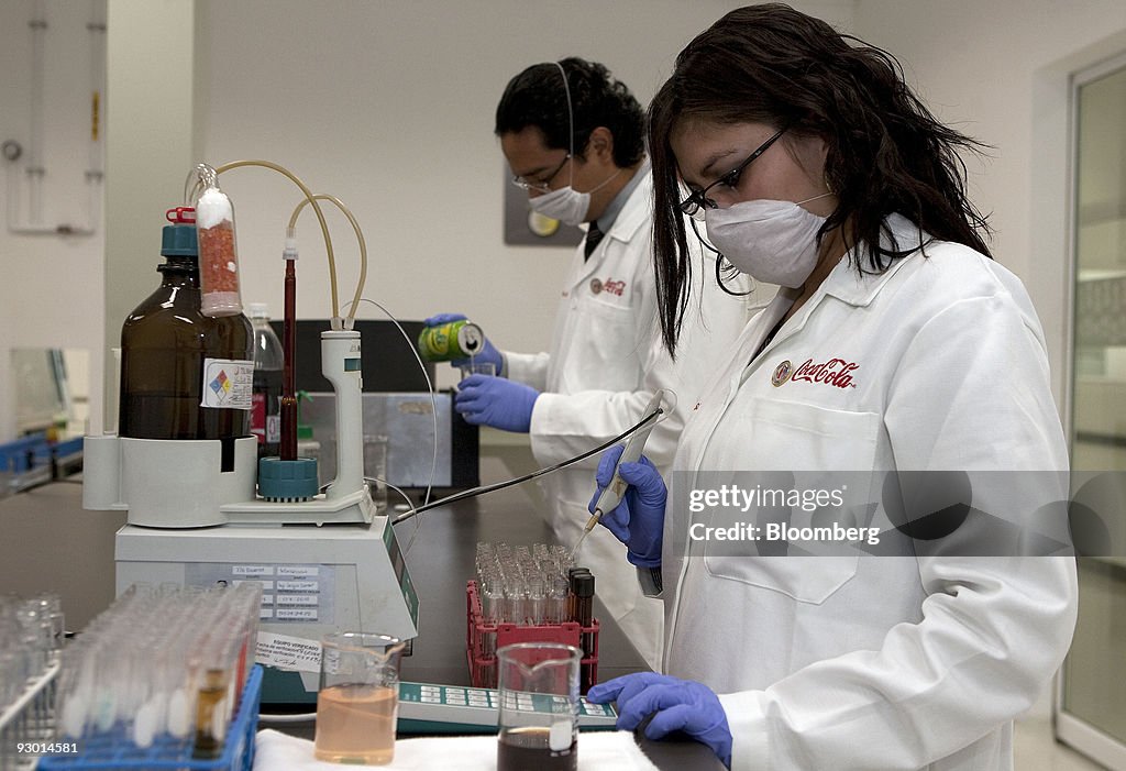 Lab Cola Coca-Cola Co. employees test samples at the new Latino America... News ...