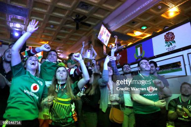 Ireland fans celebrate as they win the NatWest Six Nations Championship after watching Englands defeat to France at the Woolshed Baa on March 10,...