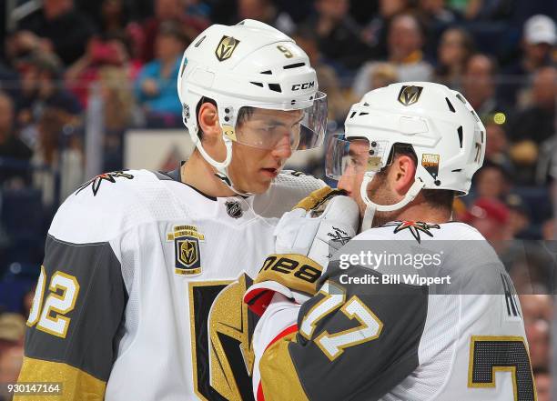 Tomas Nosek and Brad Hunt of the Vegas Golden Knights discuss strategy prior to a face-off against the Buffalo Sabres during an NHL game on March 10,...