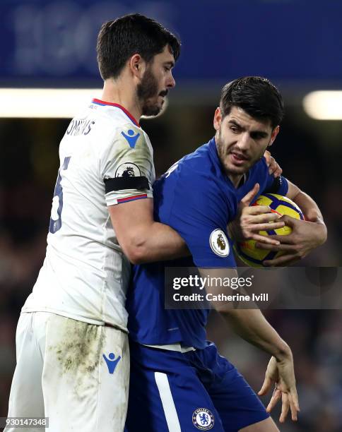 James Tomkins of Crystal Palace tries to get the ball back from Alvaro Morata of Chelsea during the Premier League match between Chelsea and Crystal...