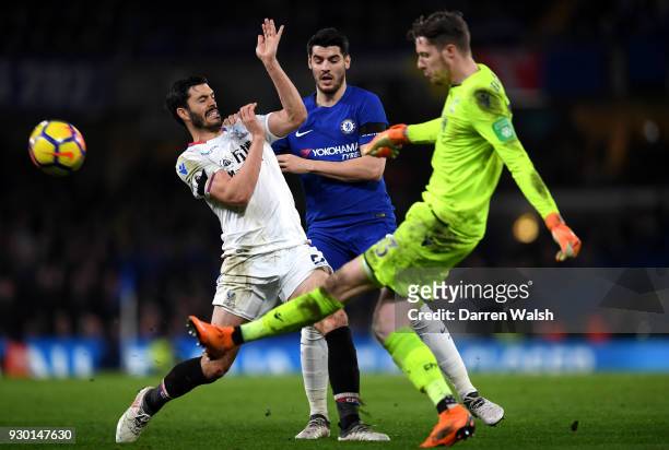 Alvaro Morata of Chelsea is challenged by James Tomkins of Crystal Palace as Wayne Hennessey of Crystal Palace clears the ball during the Premier...