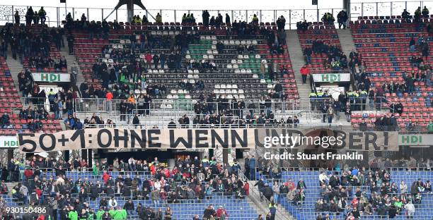 Fans of Hannover hold a banner during the Bundesliga match between Hannover 96 and FC Augsburg at HDI-Arena on March 10, 2018 in Hanover, Germany.