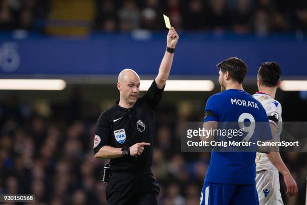 Chelsea's Alvaro Morata is shown a yellow card by Referee Anthony Taylor during the Premier League match between Chelsea and Crystal Palace at...