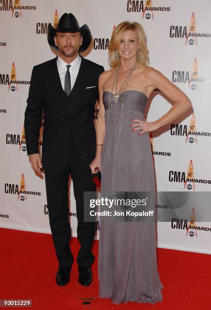Singer Tim McGraw and wife singer Faith Hill arrive at the 43rd Annual CMA Awards at the Sommet Center on November 11, 2009 in Nashville, Tennessee.