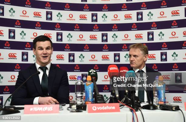 Ireland head coach Joe Schmidt and Johnny Sexton react during a press conference after winning Six Nations rugby championship following England's...