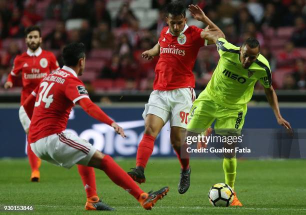 Aves midfielder Nildo Petrofina from Brazil tackled by SL Benfica midfielder Joao Carvalho from Portugal during the Primeira Liga match between SL...