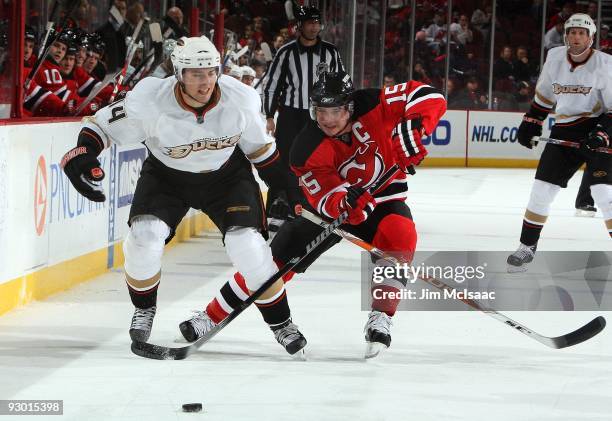 Joffrey Lupul of the Anaheim Ducks skates against Jamie Langenbrunner of the New Jersey Devils at the Prudential Center on November 11, 2009 in...