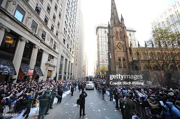 Recording artist Jay-Z and Alex Rodriguez of the New York Yankees ride in the Yankees victory parade through the Canyon of Heroes on Friday, November...