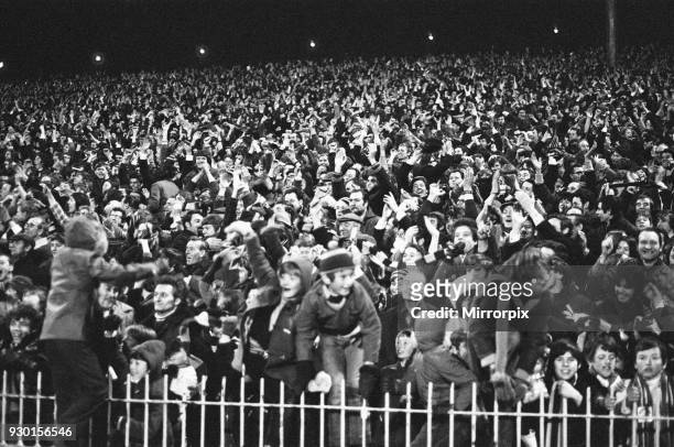 Aston Villa fans celebrate after their teams two one victory over Manchester United in the second leg of the League Cup, 23rd December 1970.