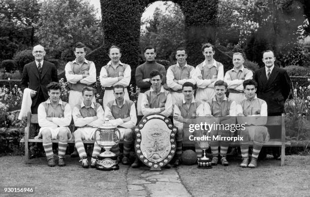 Alvechurch football club team group with trophies after winning the Redditch and District League championship, the A.E. Terry Memorial Cup as well as...