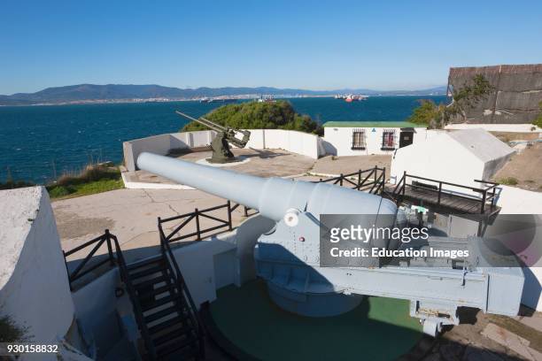 Gibraltar, 100 ton gun dating from 1880's at Napier of Magdala Battery, Rosia Bay, 3.7 inch second world war anti aircraft gun in background.
