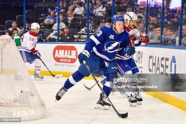 Tampa Bay Lightning center Cedric Paquette checks Montreal Canadiens right wing Andrew Shaw during the second period of an NHL game between the...