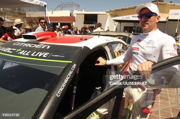 French Sebastien Loeb arrives with his Citroen C3 to sign autographs to fans during a break in the second day of the 2018 FIA World Rally...