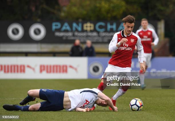 Vlad Dragomir of Arsenal rounds Oliver Skipp of Tottenham during the match between Arsenal and Tottenham Hotspur at Meadow Park on March 10, 2018 in...