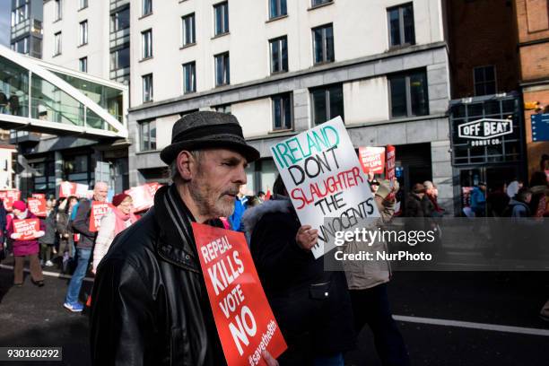 Protesters hold an anti-abortion placards during the All-Ireland Rally for Life - march to Save the 8th amendment to the Irish constitution which...