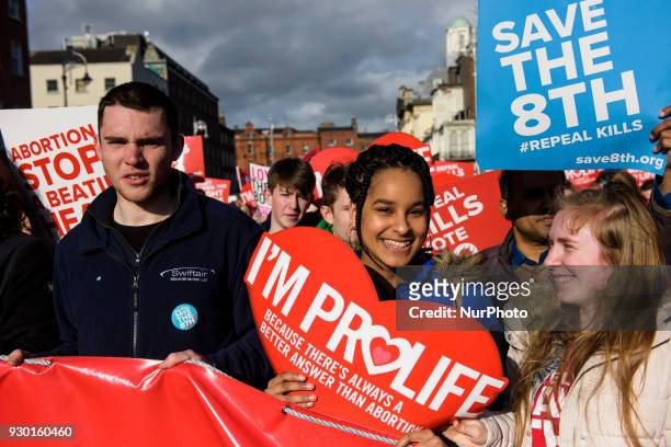 Protesters hold an anti-abortion placards during the All-Ireland Rally for Life - march to Save the 8th amendment to the Irish constitution which...