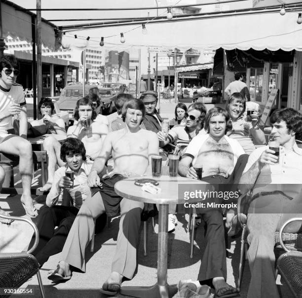 Derby County players in Majorca as they celebrate their League Titile win. Having a few pints in the Red Lion in Magaluf, 29th April 1975.