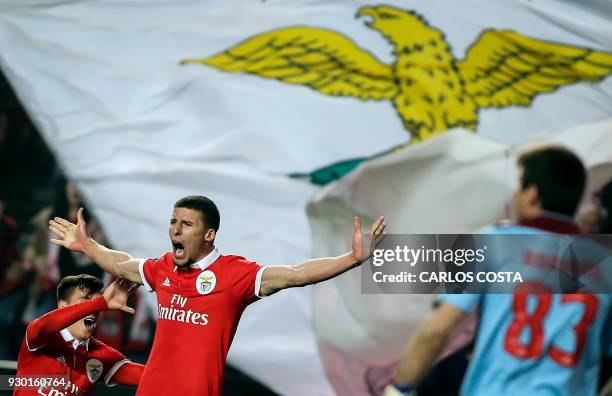 Benfica's defender Ruben Dias celebrates a goal with Benfica's Argentinian forward Franco Cervi during the Portuguese league football match between...