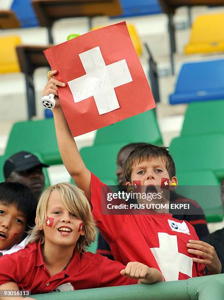 Swiss football team fans shout from the stands during paly between Swtizerland and Columbia at the on-going FIFA U-17 World Cup in Lagos on Novemeber...