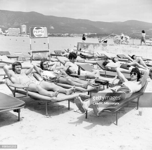 Derby County players relax in Majorca as they celebrate their League Titile win. Colin Todd and the rest of the team enjoy the sunshine on the beach,...