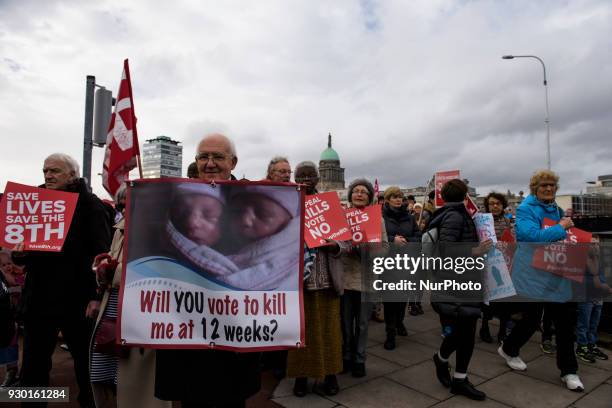 Woman holds the banner during an anti- abortion protest All-Ireland Rally for Life - march to Save the 8th amendment to the Irish constitution which...