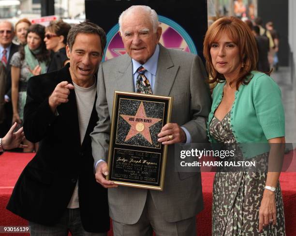 Judge Joseph A. Wapner poses with a copy of his star beside Harvey Levin from the website TMZ and Judge Marilyn Milian after he was honored with a...