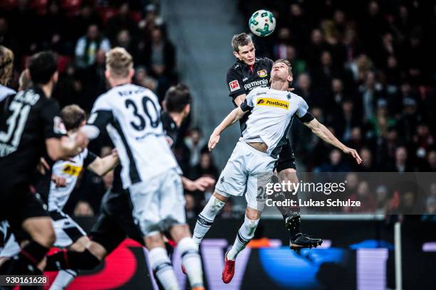 Sven Bender of Leverkusen and Matthias Ginter of Moenchengladbach head the ball during the Bundesliga match between Bayer 04 Leverkusen and Borussia...