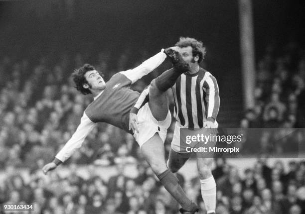 English League Division One match at Highbury. Arsenal 1 v Huddersfield 0. Ray Kennedy in action watched by a Huddersfield defender, 22nd January...