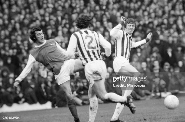 English League Division One match at The Hawthorns. West Bromwich Albion 2 v Arsenal 2. Ray Kennedy of Arsenal challenged by two West Brom players,...