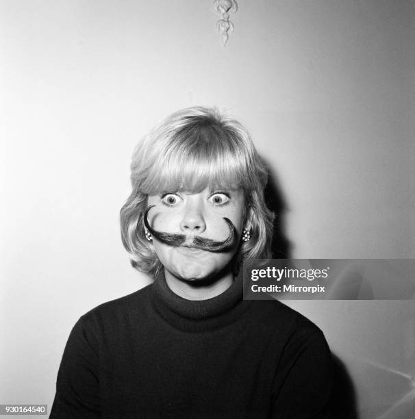 Hayley Mills wearing a genuine Dali imitation moustache, which can be bought for 12s, 6d, 20th September 1964.