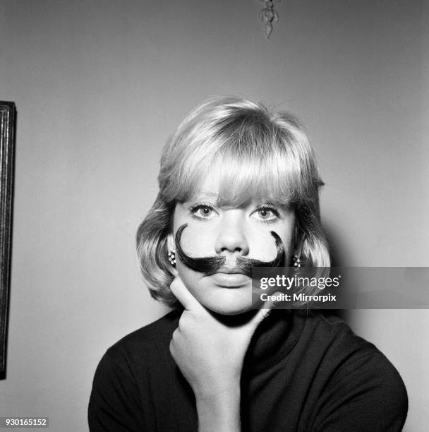 Hayley Mills wearing a genuine Dali imitation moustache, which can be bought for 12s, 6d, 20th September 1964.