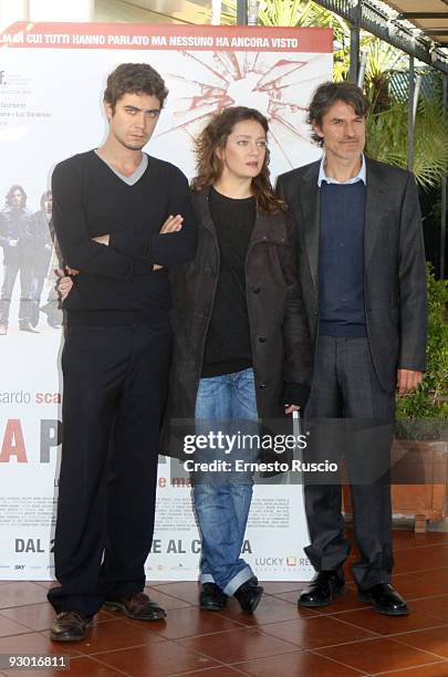 Actor Riccardo Scamarcio, actress Giovanna Mezzogiorno and Director Renato De Maria attend the 'La Prima Linea' photocall at the Bernini Hotel on...