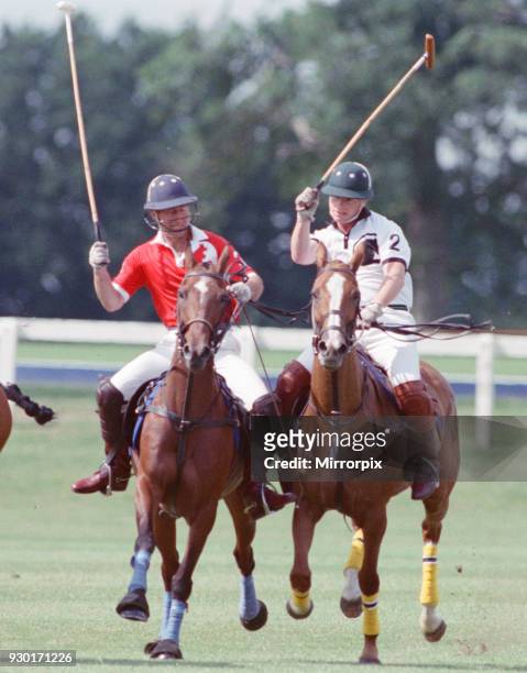 Prince Charles was locked in a fierce battle with Princess Diana's friend Major James Hewitt today , on the polo field. At one stage, as Major Hewitt...