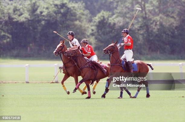 Prince Charles was locked in a fierce battle with Princess Diana's friend Major James Hewitt today , on the polo field. At one stage, as Major Hewitt...