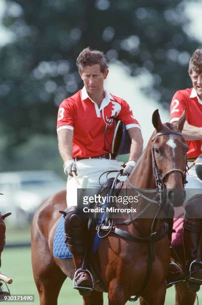Prince Charles was locked in a fierce battle with Princess Diana's friend Major James Hewitt today, on the polo field. At one stage, as Major Hewitt...