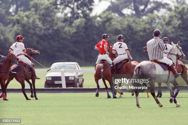 Prince Charles was locked in a fierce battle with Princess Diana's friend Major James Hewitt today , on the polo field. At one stage, as Major Hewitt...