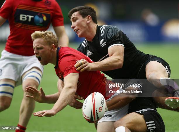 Scott Riddell of Scotland is tackled by Regan Ware of New Zealand during the Canada Sevens, the Sixth round of the HSBC Sevens World Series at the BC...