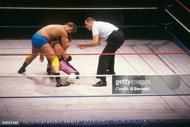 Wrestler Jacques Rougeau puts a choke hold on Bret "The Hit Man" Hart during a WWF match on July 17, 1987 at Nassau Coliseum in New York, New York.