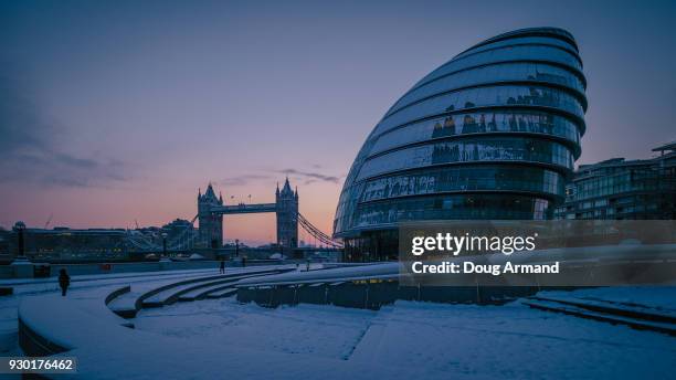 tower bridge and city hall under snow at dawn, london, uk - doug armand ストックフォトと画像