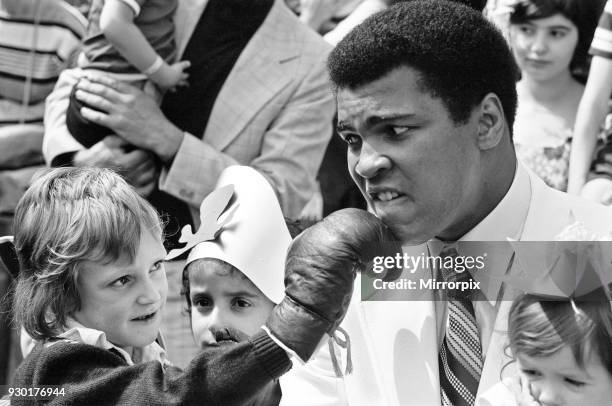 World heavyweight boxing champion Muhammad Ali presented a sunshine coach on the behalf of the Variety club of Great Britain, the children's charity...