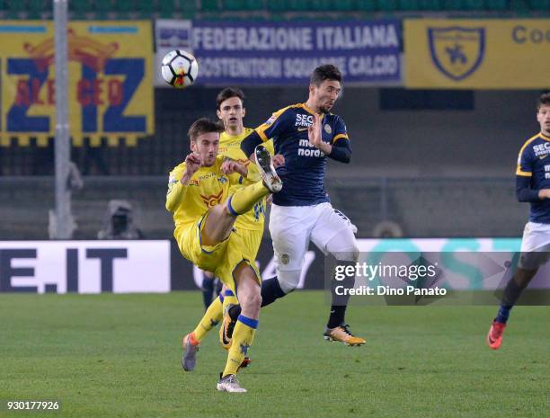 Nicola Rigoni of Chievo Verona competes with Ryder Matos of Hellas Verona during the serie A match between Hellas Verona FC and AC Chievo Verona at...